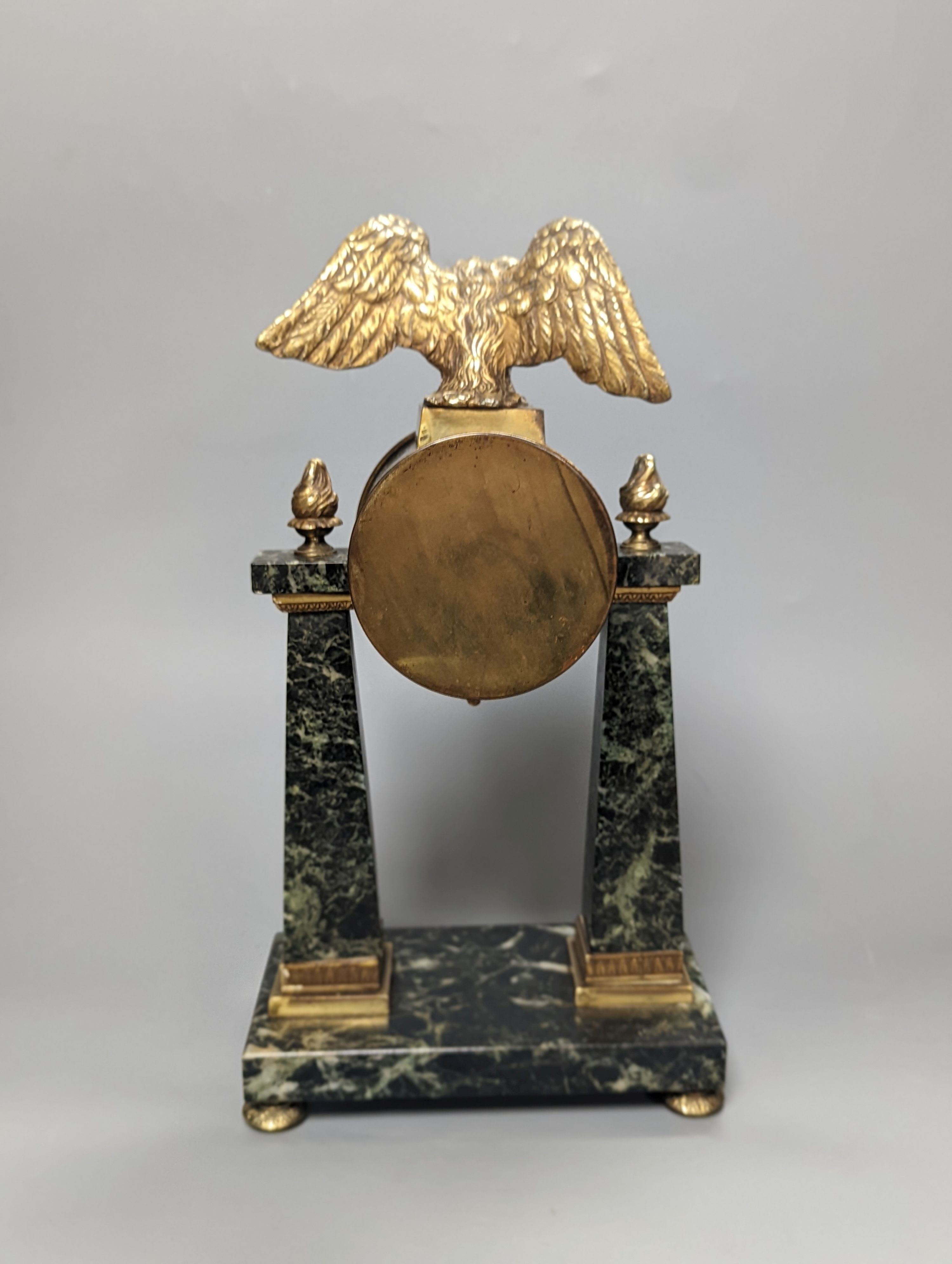 A French Empire style marble and ormolu portico timepiece 32cm